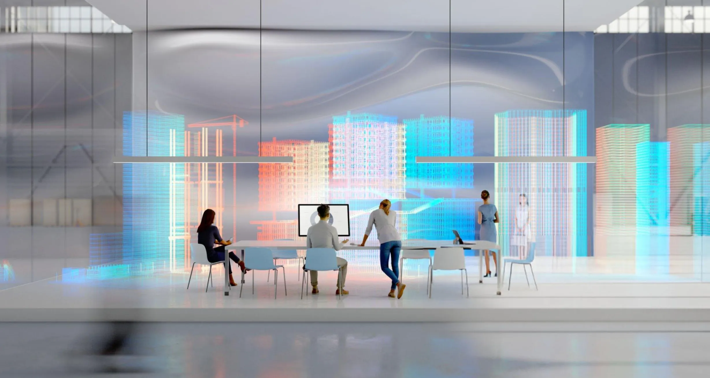 People working at a table in front of holographic city skylines
